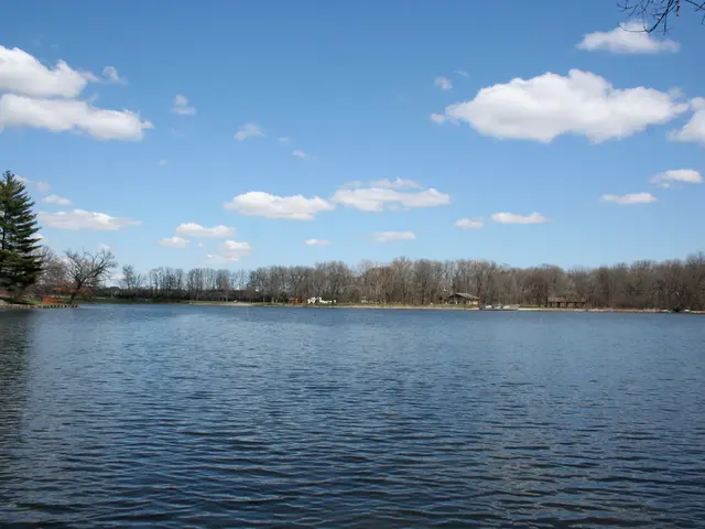 This picture is clicked outside the city. In the foreground we can see the water body. In the...