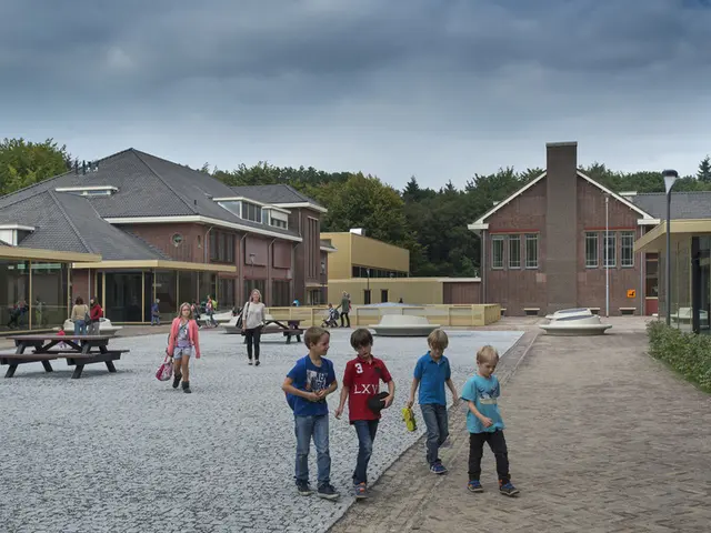 In the image there are many kids and women walking on the floor, there are homes all around the...